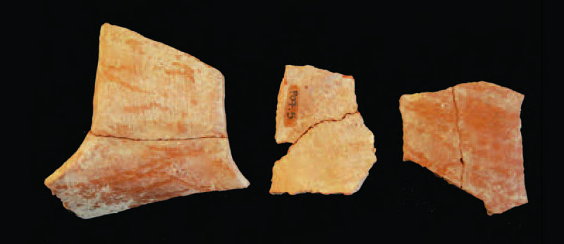 Fragments of pottery on a black background