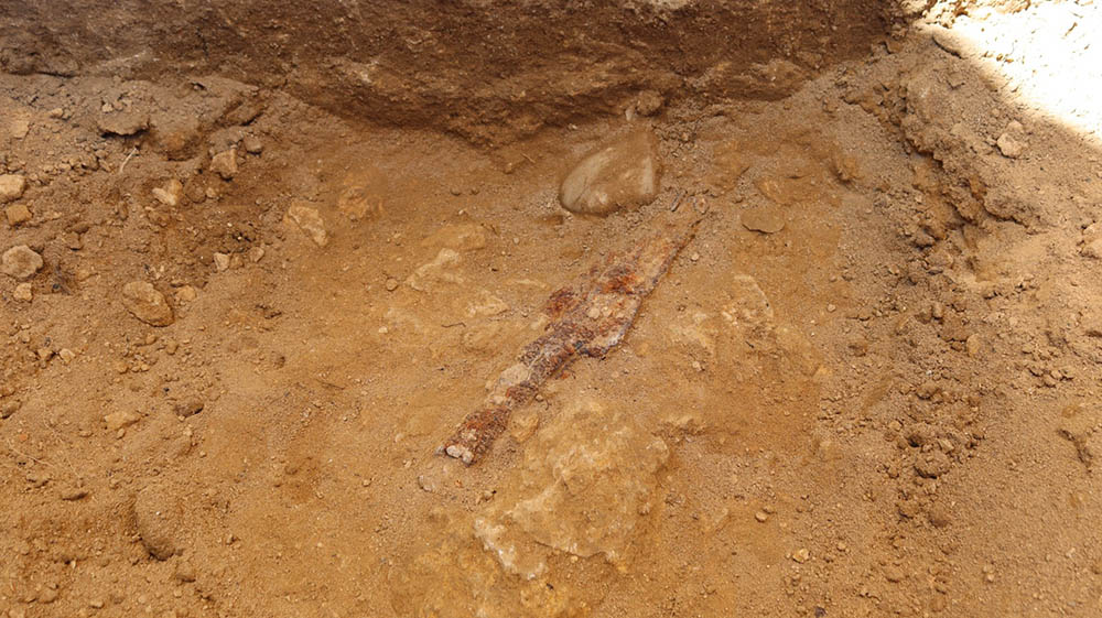 Overhead view iron fragment in the ground.