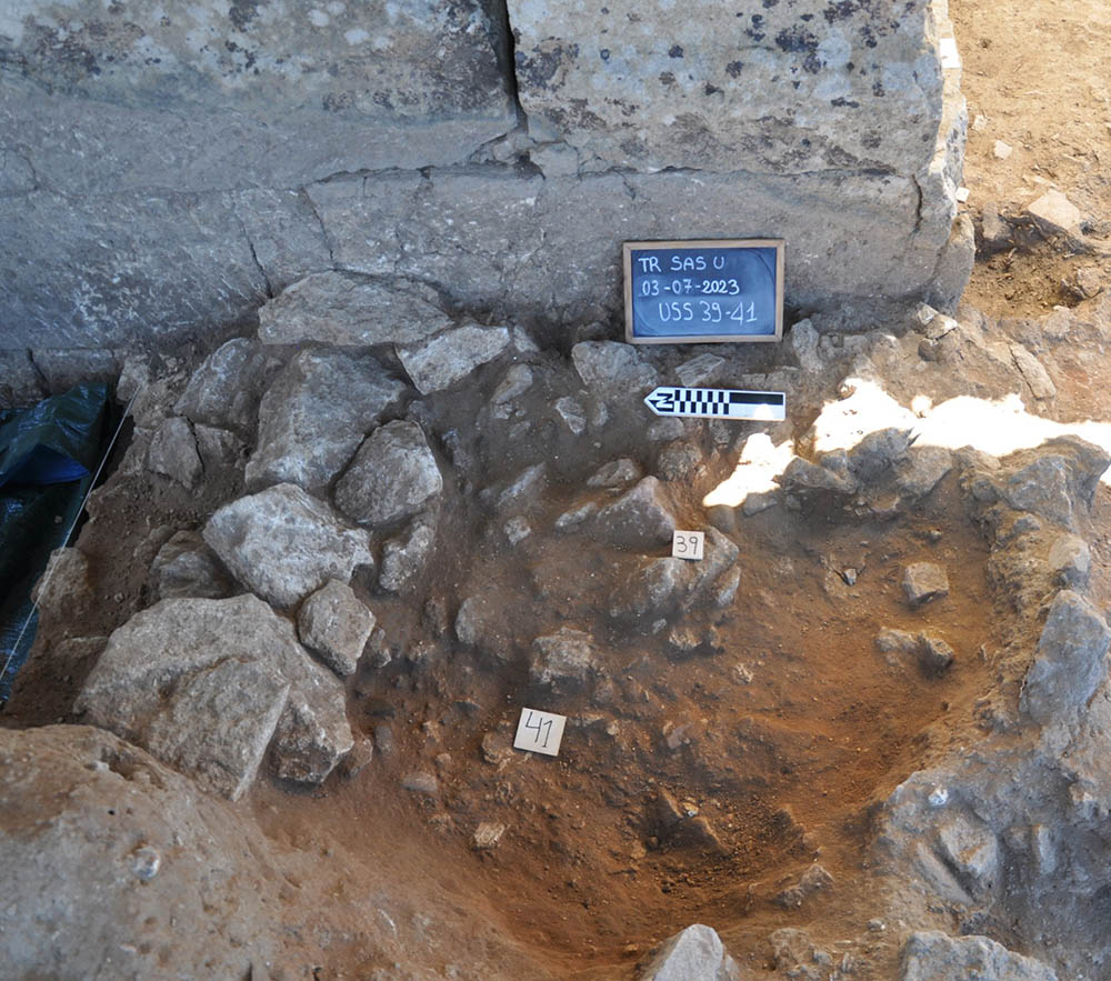 Overhead view of stones and a trench.