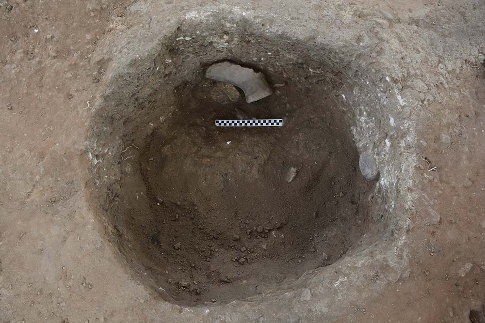 Looking down an excavated well