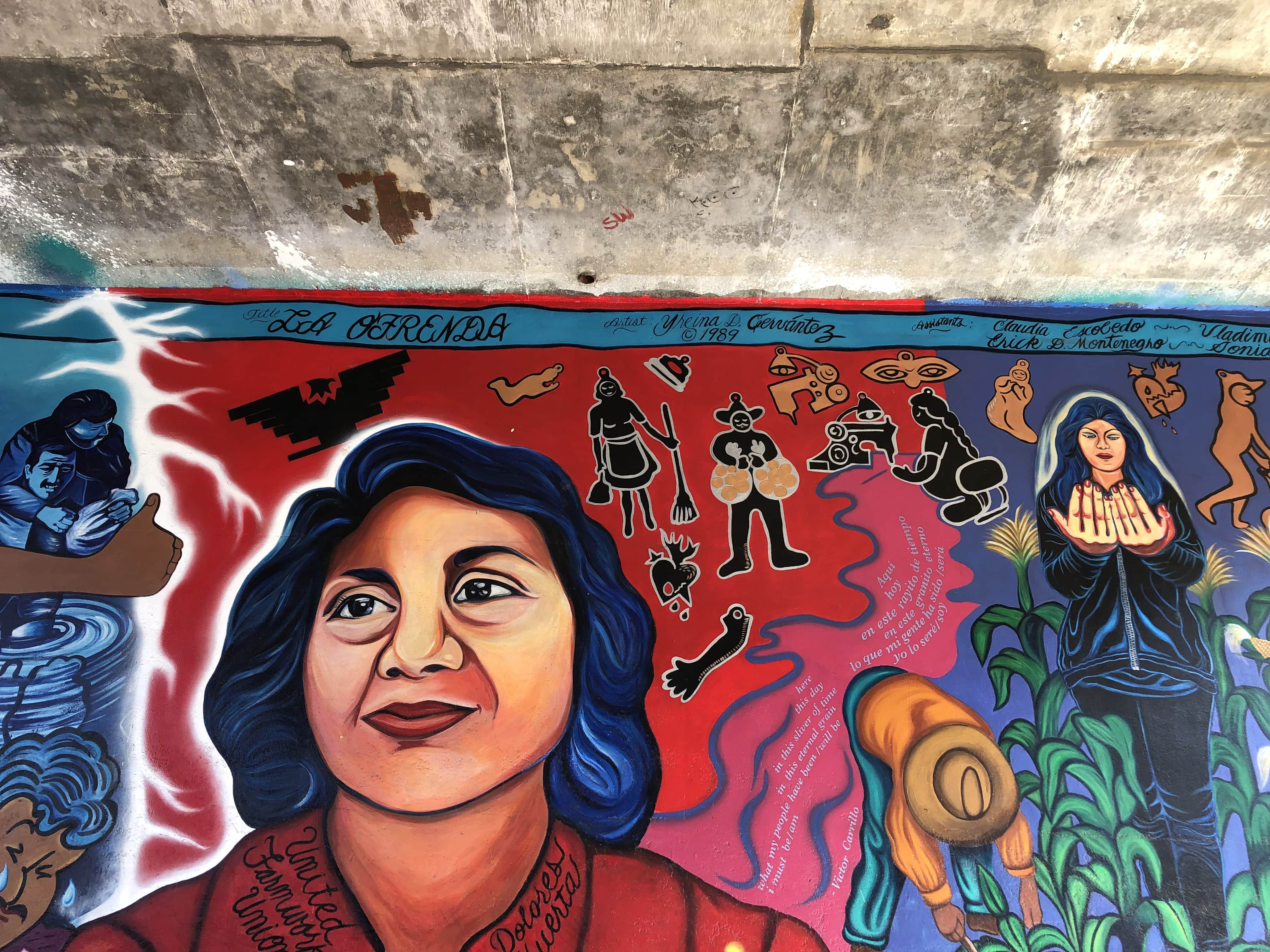 A detail highlighting Dolores Huerta who is the centerpiece figure in the mural.