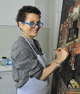 portrait of Pam Hatchfield at work on a canvas