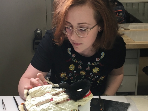 Image of Katherine Parks working on a Gut Skin Doll